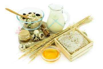 Healthy breakfast - muesli, milk, honey and eggs - health concep