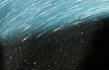 glitter vintage lights background. light silver, blue and black. defocused.
