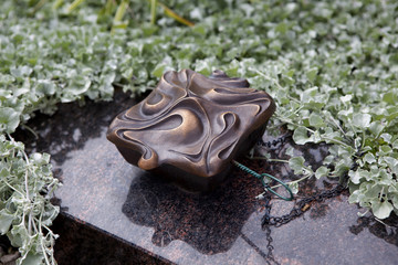 Holy water shell at the grave