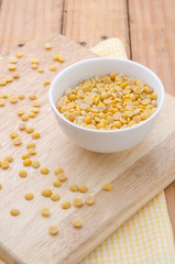 Healthy golden soil oil with a cup of raw soybean