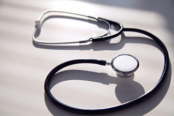Black stethoscope in blue shade, close up