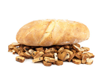 Loaf of bread and biscuits on white background.