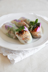 Homemade rice paper rolls with edible flowers