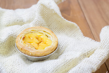 egg tart on white fabric