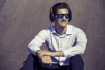 Addicted to music. image of funny business man listening African