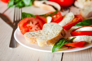 Caprese with tomatoes, mozzarella and basil