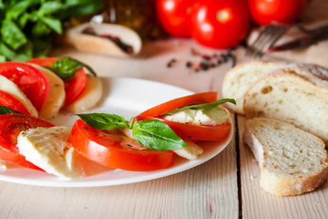 Caprese with tomatoes, mozzarella and basil