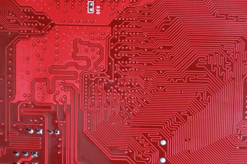 close-up of electronic circuit red board background