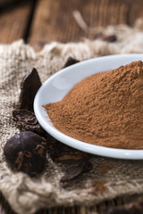 Cola Nut Powder on wooden background