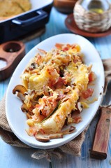 baked toasted baguette with ham, cheese, leek and cream sauce. French cuisine.