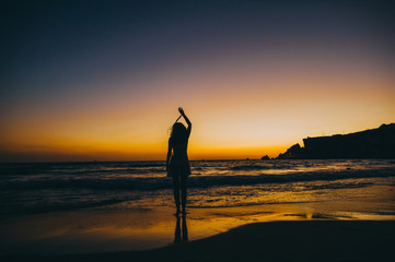 Sea beach girl silhouette, sunset