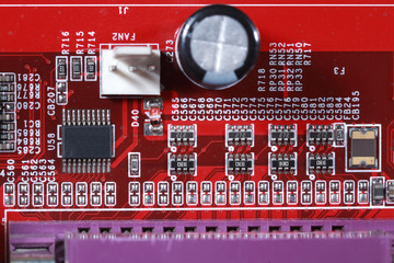 Close-up of electronic circuit red board with processor of compu