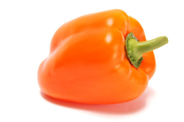 Large orange bell pepper on a white background.