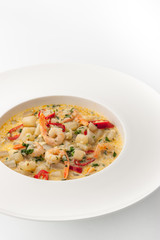 Saute with seafood on the white background vertical