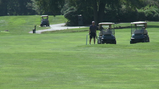 Golfer selecting club