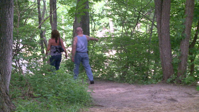 A couple hiking down a path