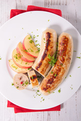grilled white sausage with apple