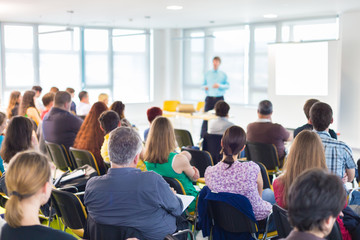 Speaker Giving a Talk at Business Meeting.