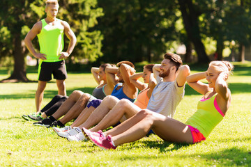 group of friends or sportsmen exercising outdoors