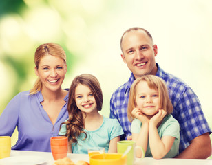 happy family with two kids with having breakfast
