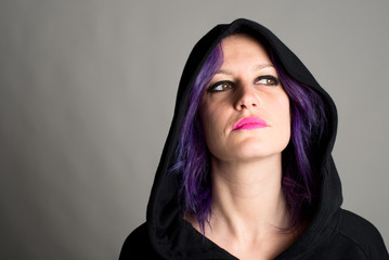 seductive hooded woman with fuchsia hair and lips