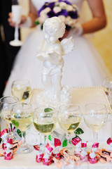 statue of Cupid in the background Bride