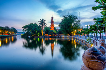 The Tran Quoc Pagoda in Hanoi is the oldest pagoda in the city, originally constructed in the sixth century during the reign of Emperor Ly Nam De. (from 544 until 548), more than 1,450 years. - obrazy, fototapety, plakaty