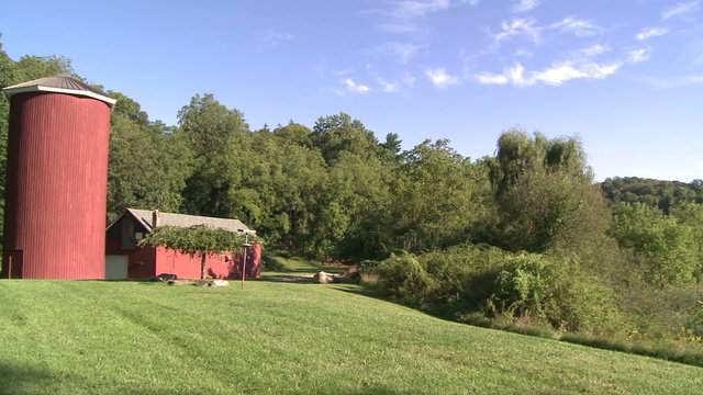 Silo behind red barn