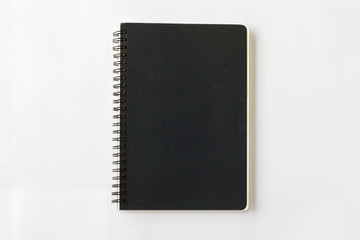 spiral black notebook on white background