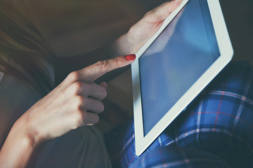 hands holding digital tablet pc and touching with finger