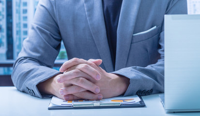 Businessman analyzing investment charts. Accounting