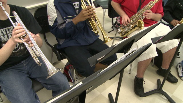 Students reading sheet music in class