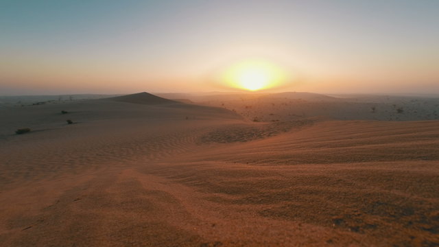 Sunrise over dunes in the Arabian desert timelapse