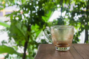 Empty glass of coffee on wood table