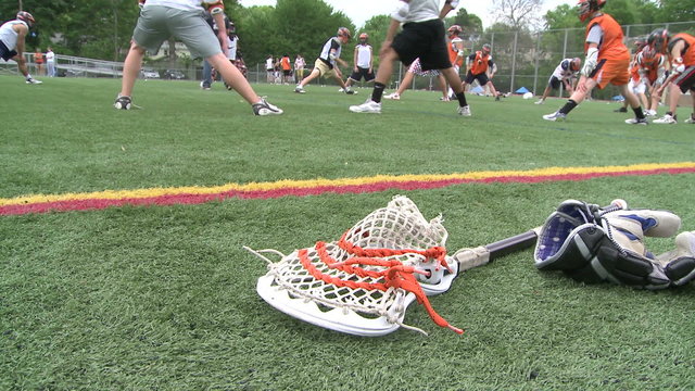 Lacrosse equipment laying on the field