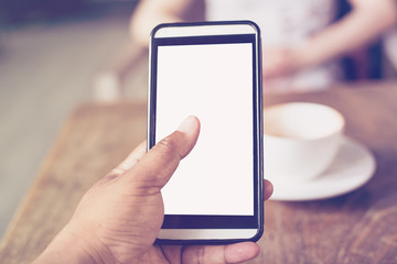 Close up of hands man using phone in coffee shop with depth of F