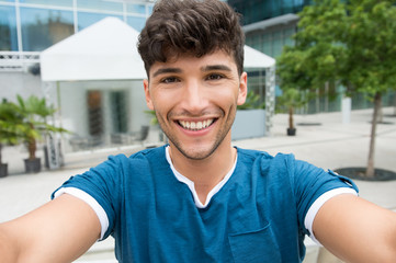 Young man takes a selfie
