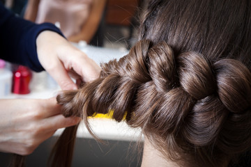 weave braids in hairdressing salon