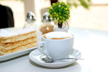 A cup of tasty cappuccino. A cup of morning coffee