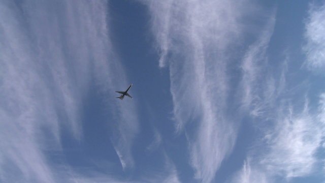 Plane descending from the clouds