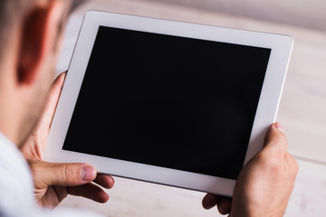 Tablet in male hands