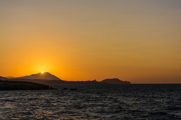 Naklejka na ściany i meble Beautiful sunset at the island of Milos.