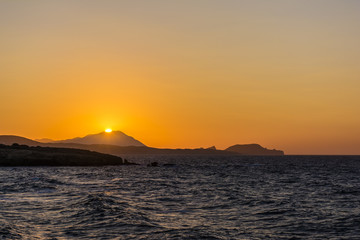 Naklejka na ściany i meble Beautiful sunset at the island of Milos.