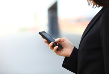 Closeup of female hand using a smart phone