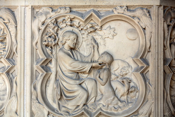 Paris -  the Sainte-Chapelle (Holy Chapel).The base of the portal on both sides is decorated with low relief representing scenes of the Genesis