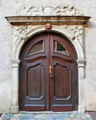 Fototapeta premium Vintage entrance door on a building facade in old Riga city, Lat
