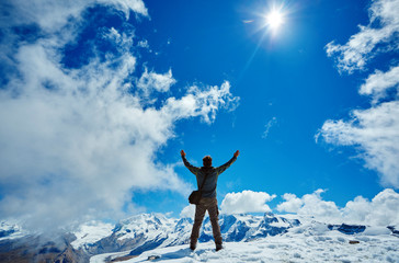 hiker at the top of a pass