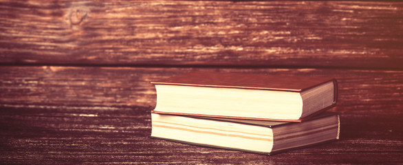Vintage old books on wooden table