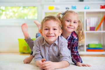 Cute little brother and sister having fun