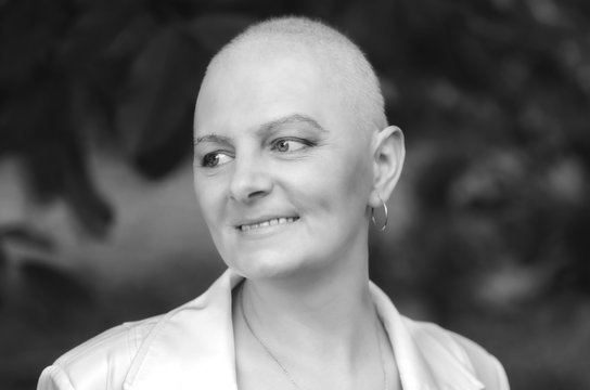 Portrait of breast cancer survivor woman with positive attitude.